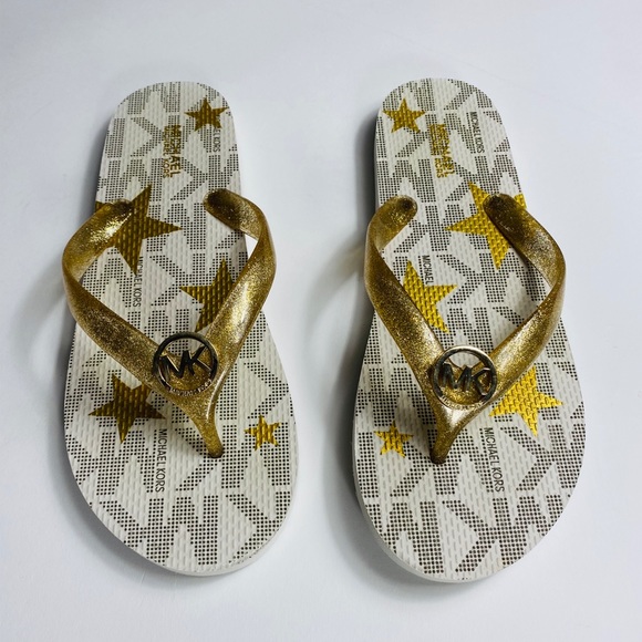 white and gold flip flops